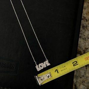 10K white gold “LOVE” necklace with 10 diamonds